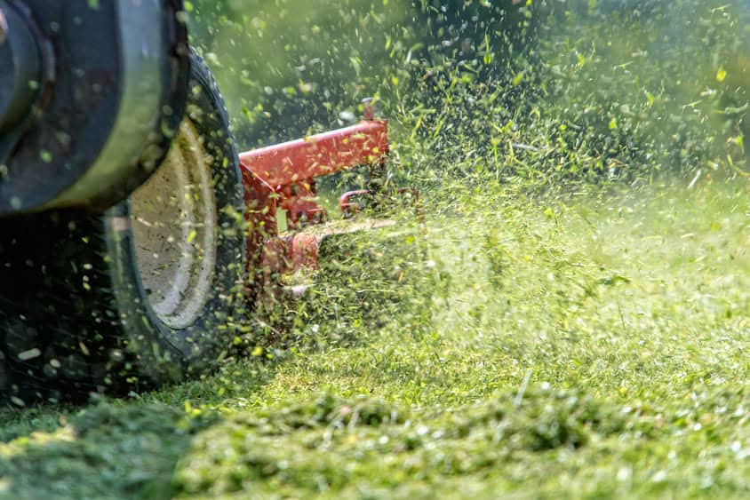 mowing the lawn on a riding mower