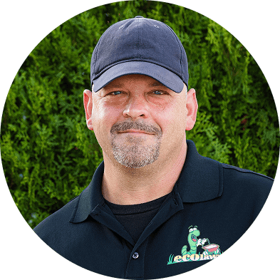 EcoLawn professional using commercial lawn equipment for eco-friendly landscaping and lawn care services.